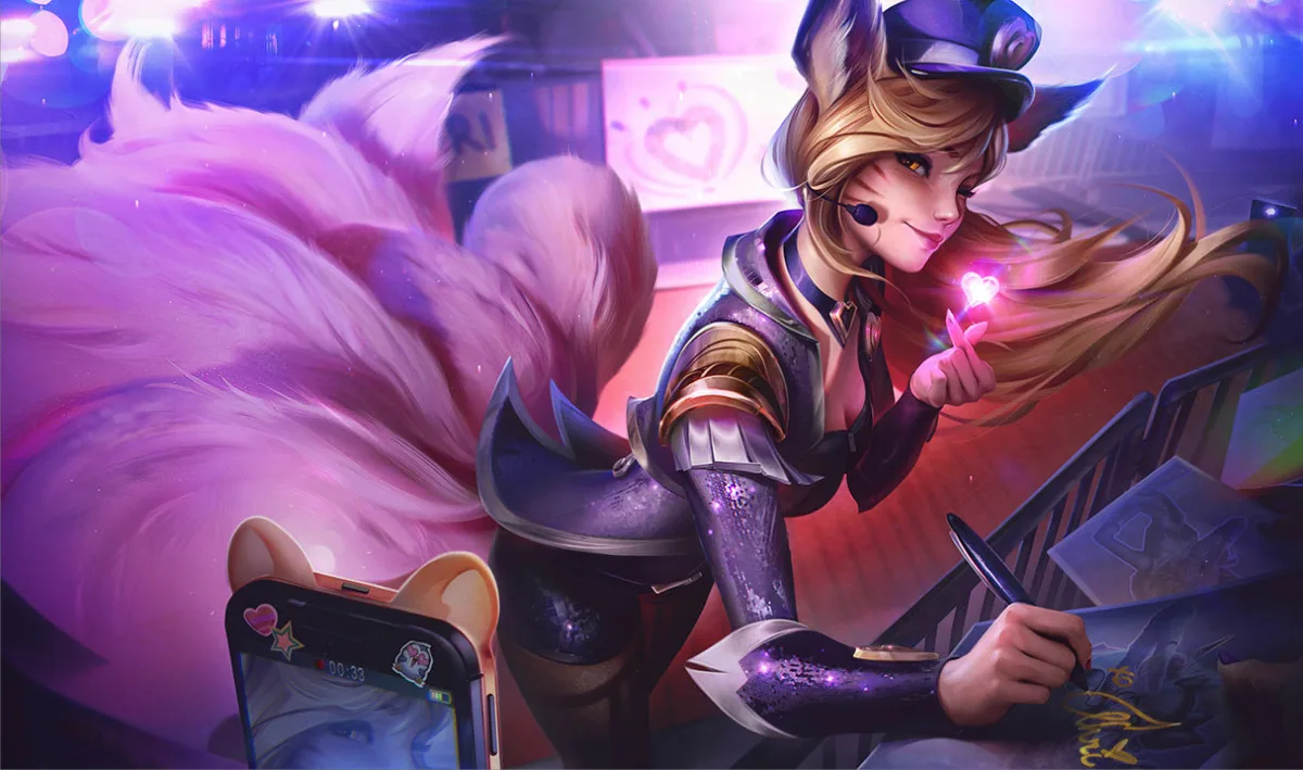 Popstar Ahri signing an album cover while a fan records her beneath pink stage lights