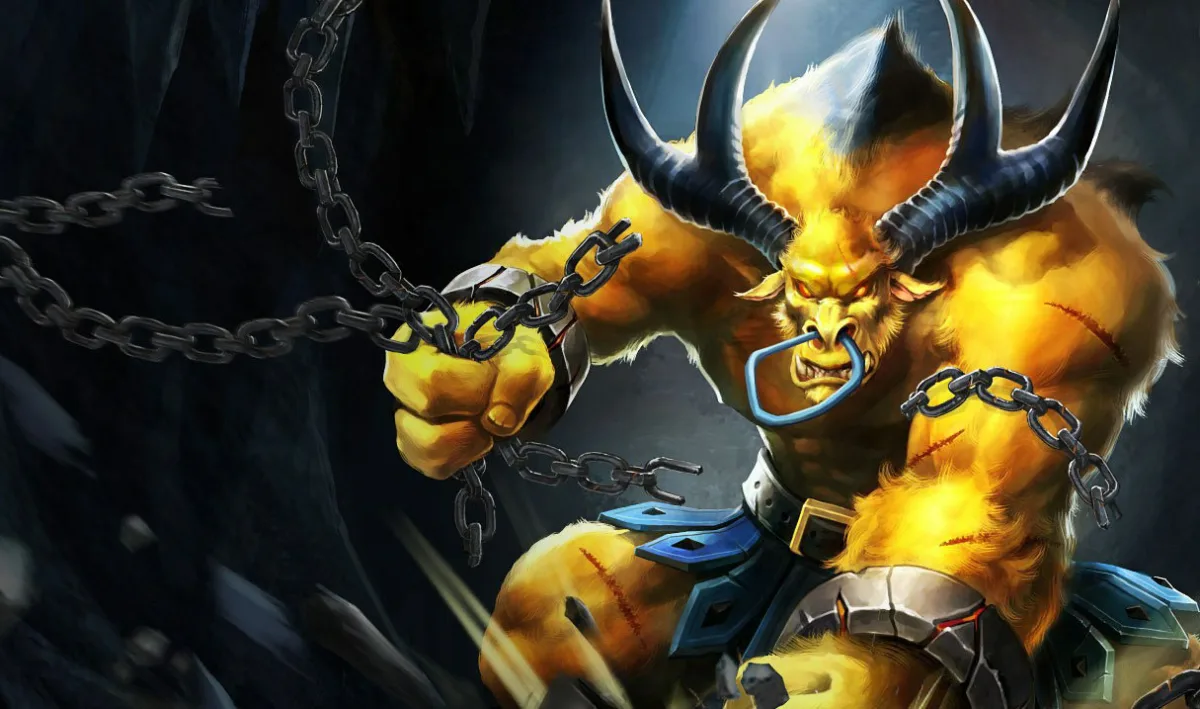 Golden Alistar has yellow-gold fur, a white mohawk, dark horns and a blue square nose ring, with chains across his arms.