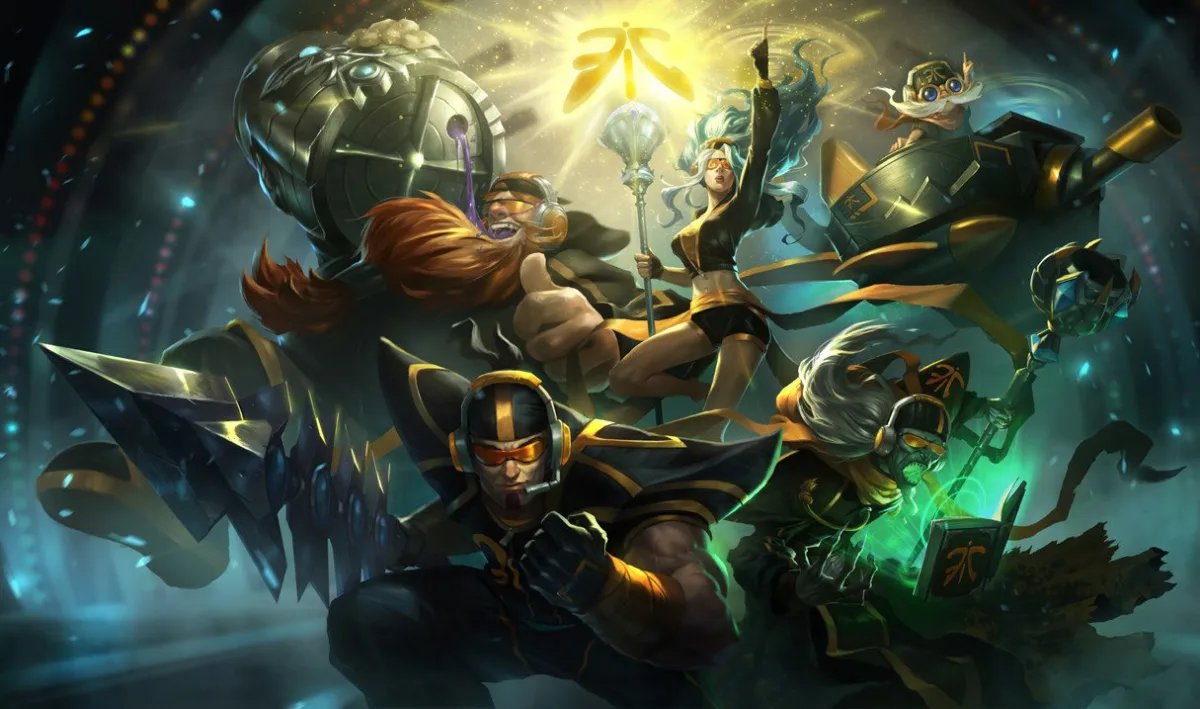 Fnatic Karthus in the lower-right foreground of the team splash, wearing orange goggles and a headset beside a green-glowing team-branded book