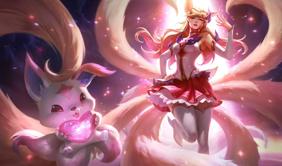 Star Guardian Ahri in a pink and white costume among sweeping white tails, beside a small familiar holding a glowing pink heart.