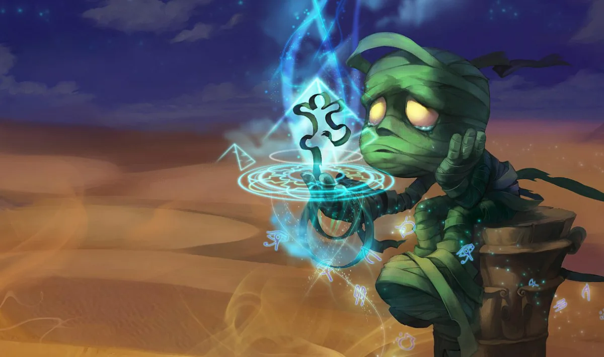 Amumu sitting on a stone vessel while blue runes glow around him in the desert